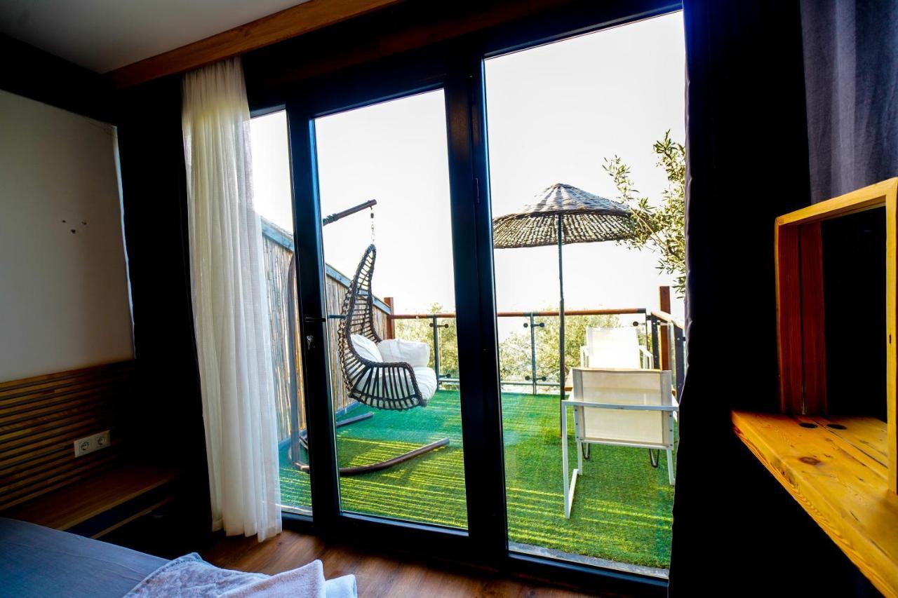 Qcunda Otel ไอวาลิค ภายนอก รูปภาพ