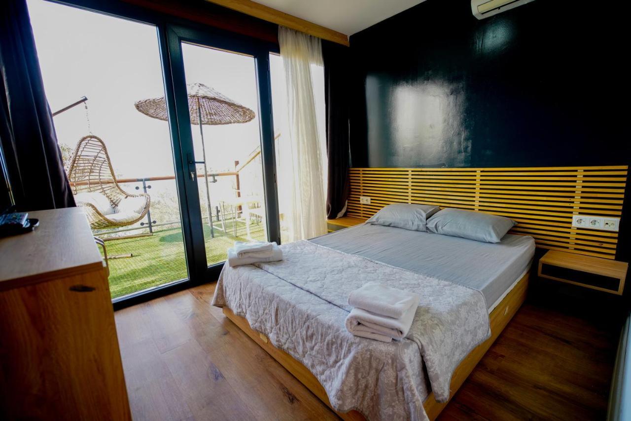 Qcunda Otel ไอวาลิค ภายนอก รูปภาพ